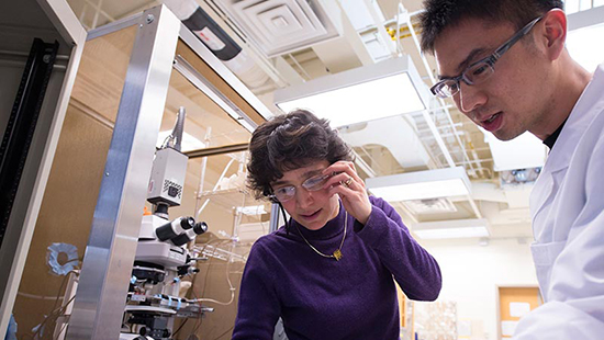 Student and faculty in lab