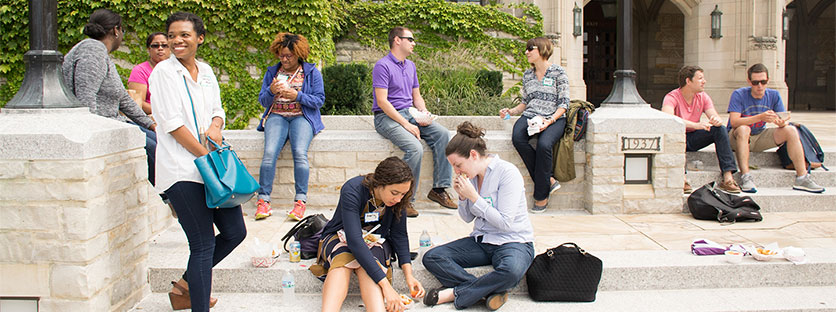Staff in front of Deering Library enjoying a picnic