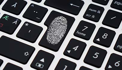 image of laptop with fingerprint on enter key