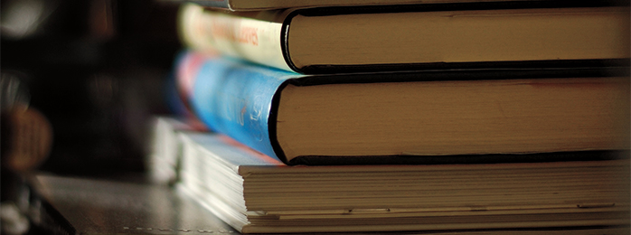 Photograph of a stack of books.