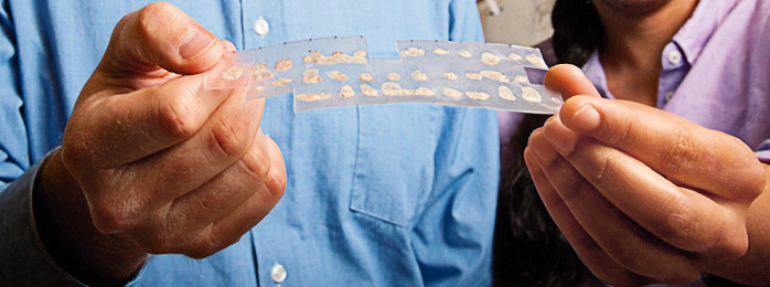 Image of hands holding lab supplies