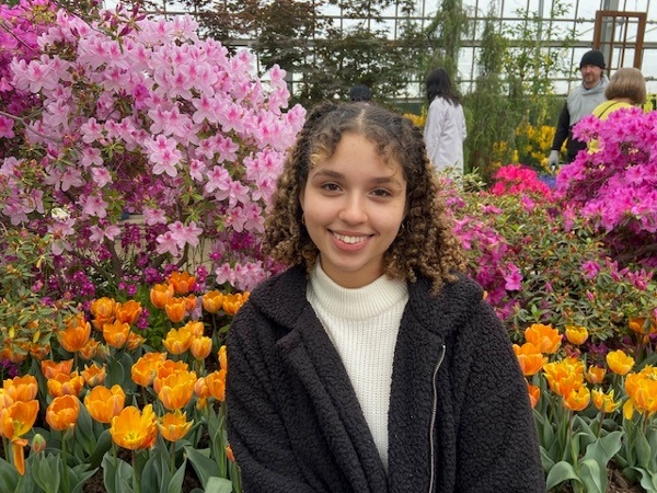 martha wondowassen photograph in front of flowers