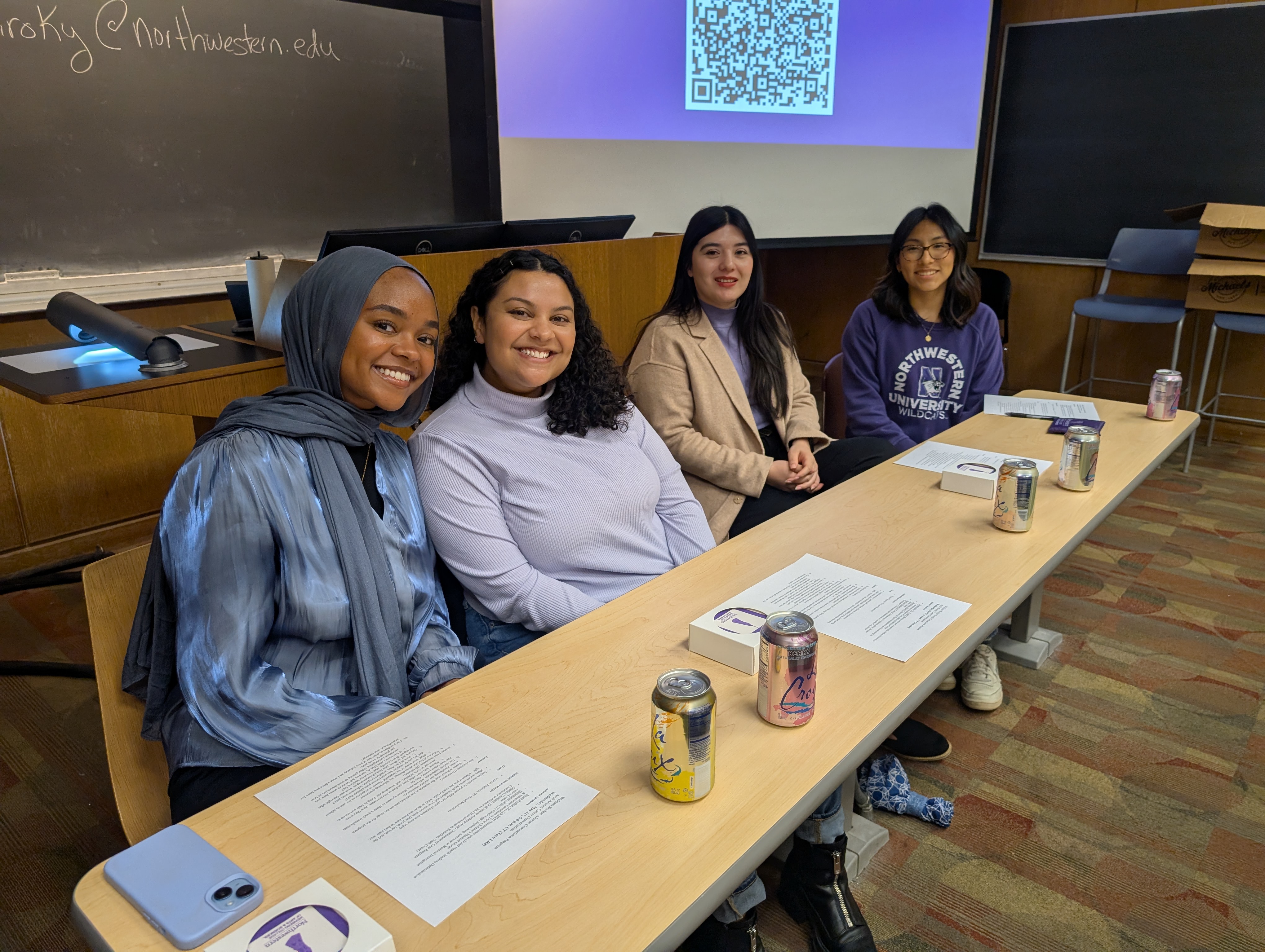 Arch scholars sitting at table.jpg